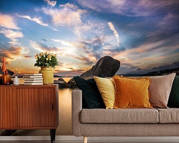 Sunset on the coast of Greece with beach and stones and stick by Fotos by Jan Wehnert