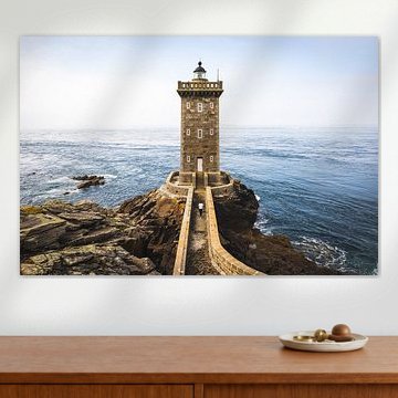 Woman walks to the Kermorvan lighthouse