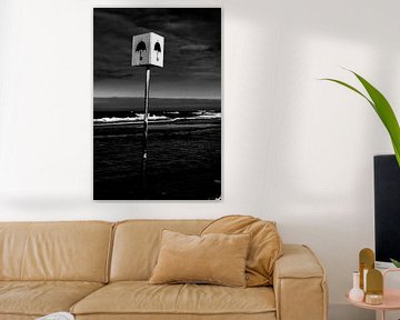 Photo d'un panneau avec parasol sur la plage près de Petten sur Wim Stolwerk