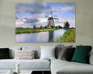 Dutch scenery with ancient brick windmill near a small canal by Tony Vingerhoets