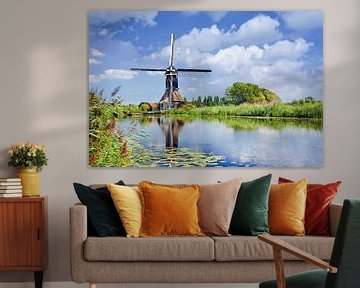 Scene with a canal with lush vegetation and ancient windmill  by Tony Vingerhoets