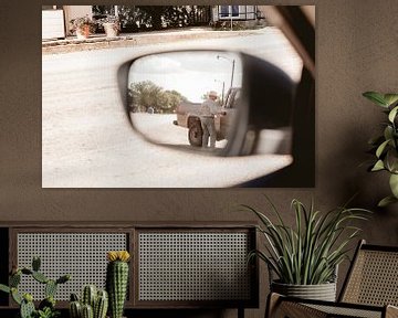 Cowboy in the side mirror of a car by Moniek Kuipers