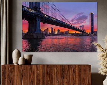 Skyline of Manhattan and Manhattan Bridge at sunset, New York, USA by Markus Lange