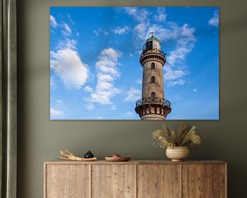 View of the lighthouse in the Baltic seaside resort Warnemünde by Rico Ködder