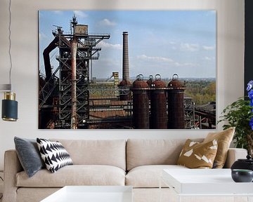 Former Lapadu blast furnace complex in Duisburg with rusty storage silos on top. by Robin Verhoef