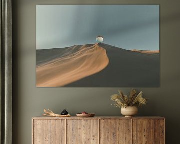 Glass ball on sand dune by Besa Art