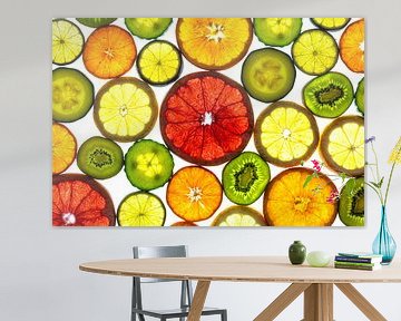 Collage of slices of fruit and vegetables with a white background. by Carola Schellekens