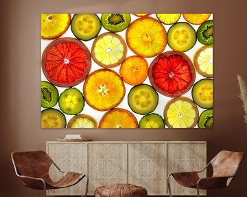 Collage of slices of fruit and vegetables with a white background. by Carola Schellekens