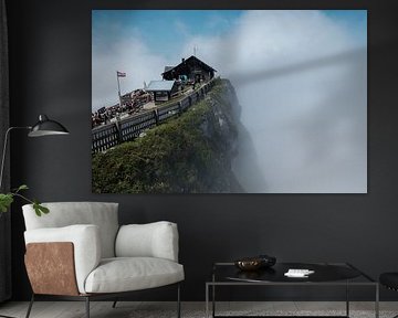 Mountain Hut in the Clouds on a Spectacular Cliff by Martijn van den Hil