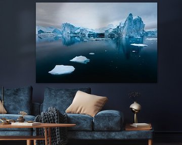 Reflection iceberg in deep black ocean by Martijn Smeets
