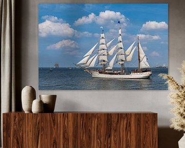 Antique tall ship, vessel leaving the harbor of The Hague, Scheveningen under a sunny and blue sky by Digikhmer