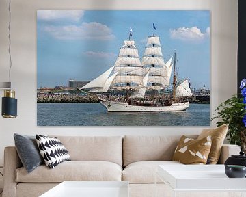 Antique tall ship, vessel leaving the harbor of The Hague, Scheveningen under a sunny and blue sky by Digikhmer