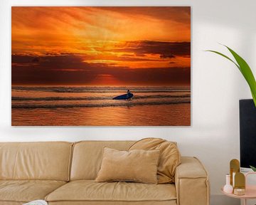 Bali Kuta surfer woman in the sea with crass red sky by Fotos by Jan Wehnert