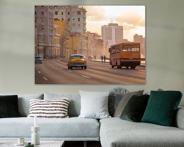 Classic cars and school bus at sunset in Havana, Cuba by Teun Janssen