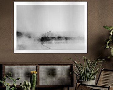 Inland navigation transport ship or barge  in the mist on a river - stylized black and white image w by John Quendag