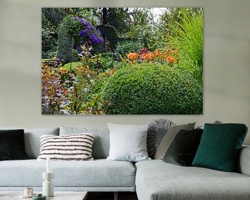 Un jardin luxuriant avec une gamme de plantes vertes et fleuries sur Gert Bunt