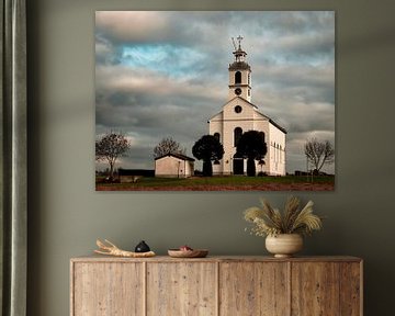 Le ciel néerlandais au-dessus de l'église de Simonshaven sur Marjolein van Middelkoop