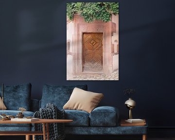 Wooden door, pink wall and greenery in France | Travel photography Europe | Pastel art photo print by Milou van Ham