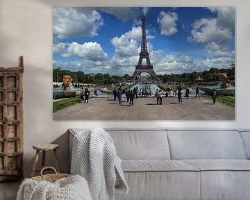 Tourists take pictures of the Eifel tower in Paris, France