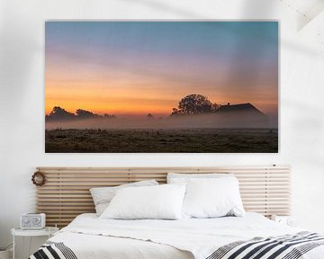 Sunrise on a misty farm