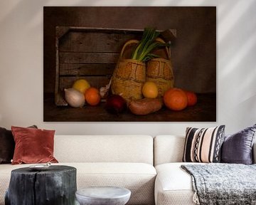 still life with a wooden box with old dutch worn out wooden shoes and various fruits by ChrisWillemsen