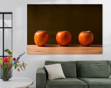 three sharonfruit in a row. by Lieke van Grinsven van Aarle