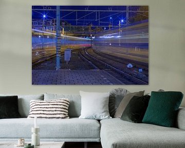 Lichtspoor van treinen (Spoorweg) van Marcel Kerdijk