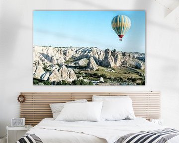 Hot air balloon and rocky landscape