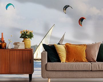 Old traditional sailboats on the beach in Zanzibar with kite surfers in the background by Michiel Ton