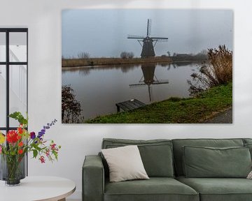 Molen Kinderdijk in de mist van Merijn Loch