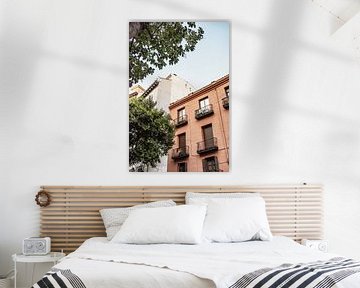 Terracotta building with tree in Madrid, Spain by Photo Atelier