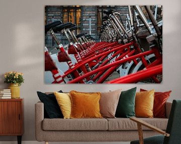 Red bikes in a row by Marjolijn Maljaars