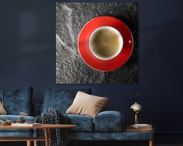 Red coffee cup on stone by Achim Prill