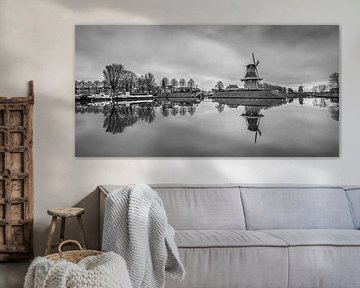 The canal around Dokkum with its recognizable windmills in black and white by Harrie Muis