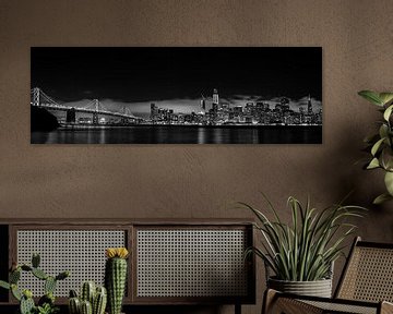 Panorama shot of San Francisco skyline at night with bay bridge in black white in low key by Dieter Walther