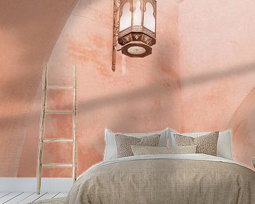 Pink wall and lantern in Marrakech by Leonie Zaytoune