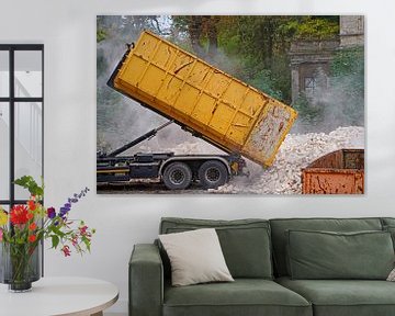 Truck on a construction site dumping a container with stones by Babetts Bildergalerie
