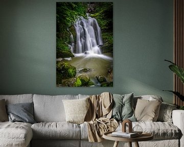 A hidden waterfall between the mountains in France by Vincent Alkema