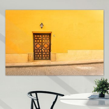 Wooden door against yellow background