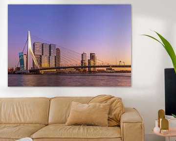 The Erasmus bridge in Rotterdam during the golden / blue hour in a colorful glow