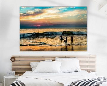 Bathing family on the beach at sunset in Sri Lanka by Dieter Walther