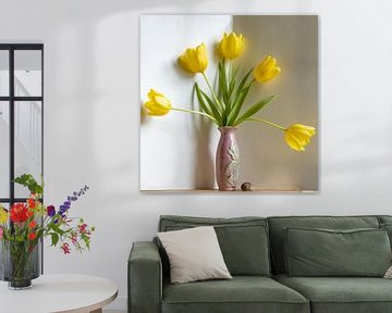 Yellow tulip fan in pink vase