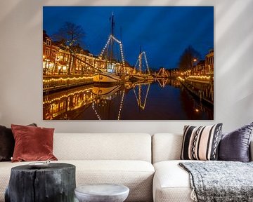 Decorated traditional sailboats in the harbour of Dokkum in the evening by Eye on You