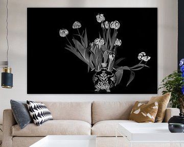 Black and white still life of wilted red tulips in a Delft blue tulip vase by WorldWidePhotoWeb