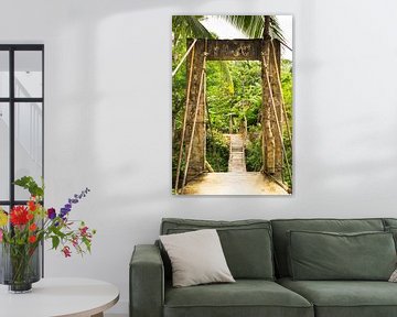 Bamboo bridge on Bohol surrounded by palm trees by Travelaar