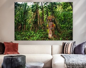 Traditionally dressed man with drum in the jungle of Papua New Guinea. by Ron van der Stappen