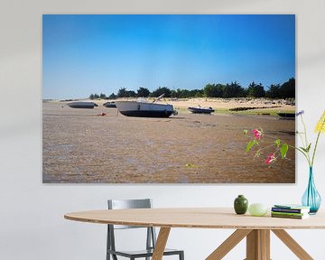 Boats on the beach at low tide by Youri Mahieu