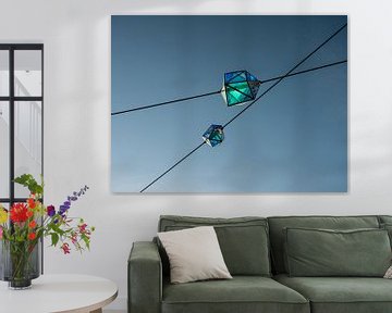 Moderne  blauwe lantaarns van glas in de lucht van Moniek van Rijbroek