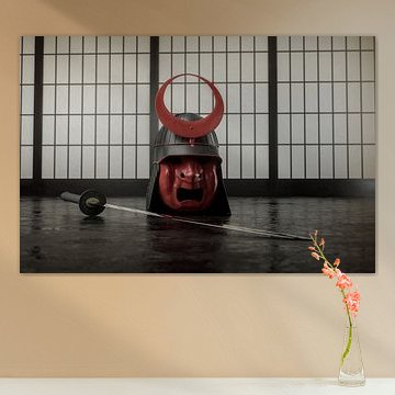 Antique samurai helmet next to katana sword in traditional japanese room