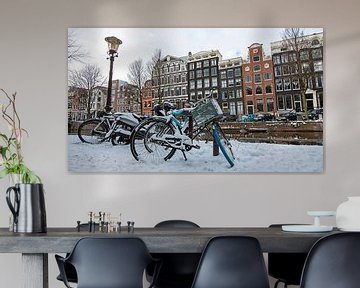 Besneeuwd Amsterdam op de grachten van Eye on You